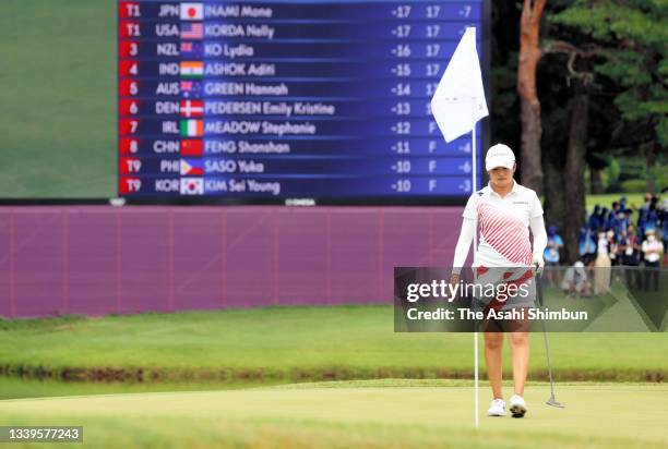 Mone Inami of Team Japan lines up the par putt on the 18th green during the final round of the Women's Individual Stroke Play on day fifteen of the...