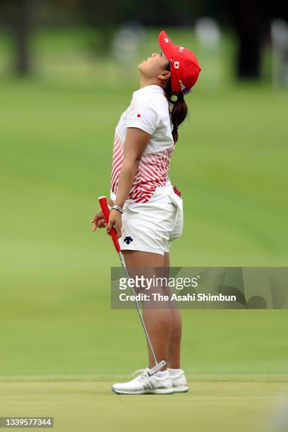 Nasa Hataoka of Team Japan reacts after missing the birdie putt on the 13th green during the final round of the Women's Individual Stroke Play on day...