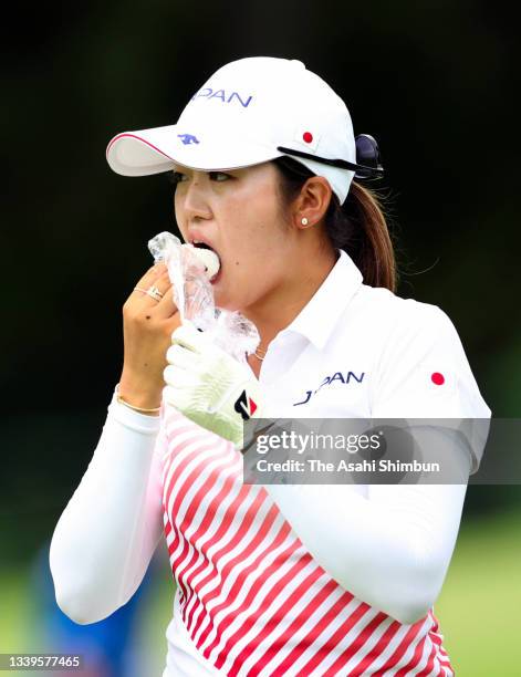 Mone Inami of Team Japan has a bite on the 11th hole during the final round of the Women's Individual Stroke Play on day fifteen of the Tokyo 2020...