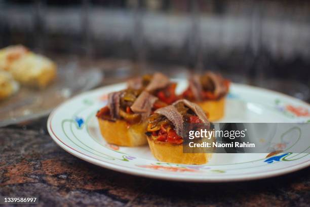 anchovy & capsicum pintxos on a plate in san sebastián, spain - anchovy stock pictures, royalty-free photos & images