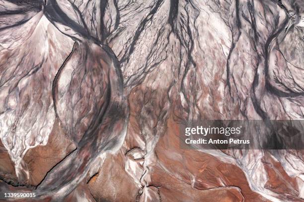 abstract patterns of a tailing dump near an iron ore quarry. aerial view - metal ore stock pictures, royalty-free photos & images
