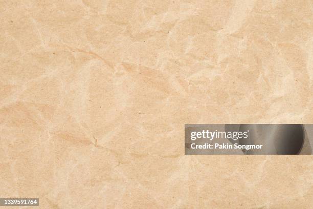 brown eco recycled kraft paper sheet texture cardboard background. - wrapping paper ストックフォトと画像