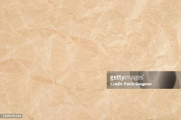 brown eco recycled kraft paper sheet texture cardboard background. - brown paper bag background stock pictures, royalty-free photos & images