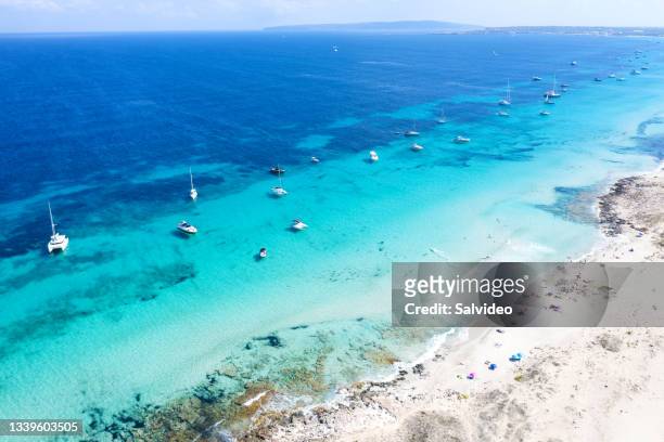 people sunbathing in illetes, formentera - spain - ibiza strand stock pictures, royalty-free photos & images