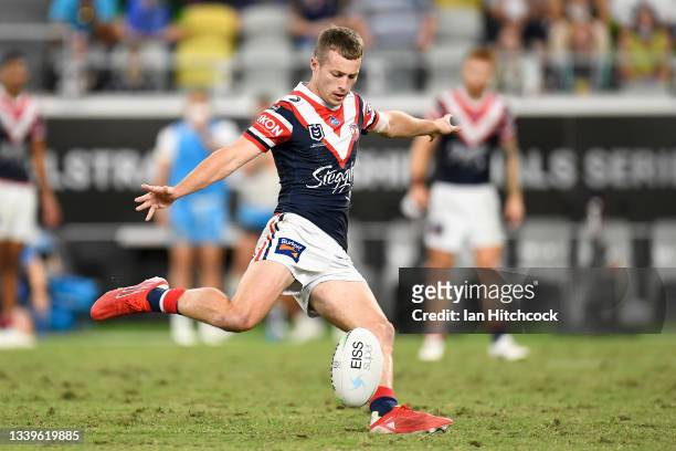 Sam Walker of the Roosters kicks the winning field goal during the NRL Elimination Final match between Sydney Roosters and Gold Coast Titans at QCB...