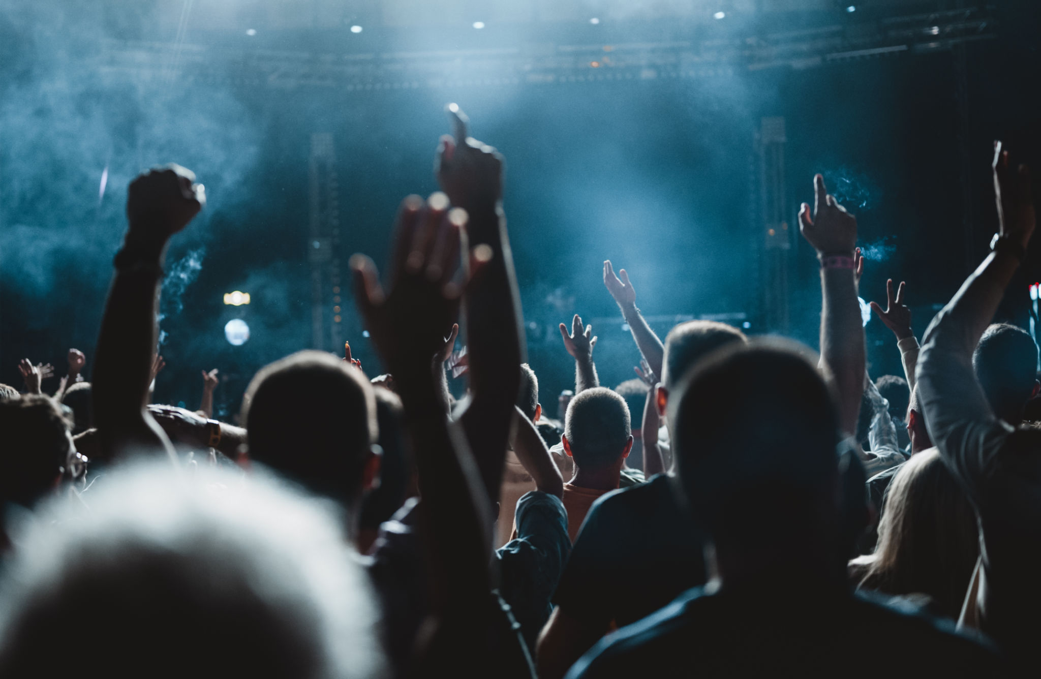 Cheering funs at a music festival Cheering funs at a music festival