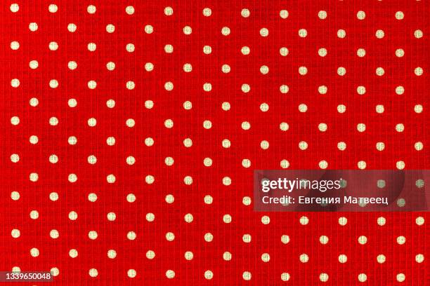 red and white polka dot natural cotton cloth fabric textile background texture. close-up. copy space - rood kleed stockfoto's en -beelden