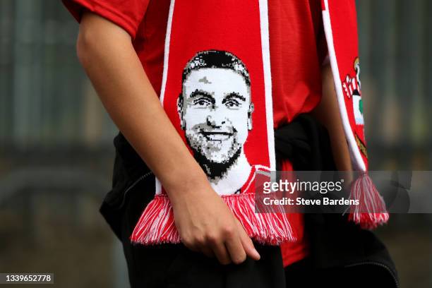 Scarf with the face of Rickie Lambert, Former player of Southampton is seen prior to the Premier League match between Southampton and West Ham United...