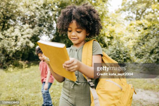 how to make learning fun - kids backpack stock pictures, royalty-free photos & images