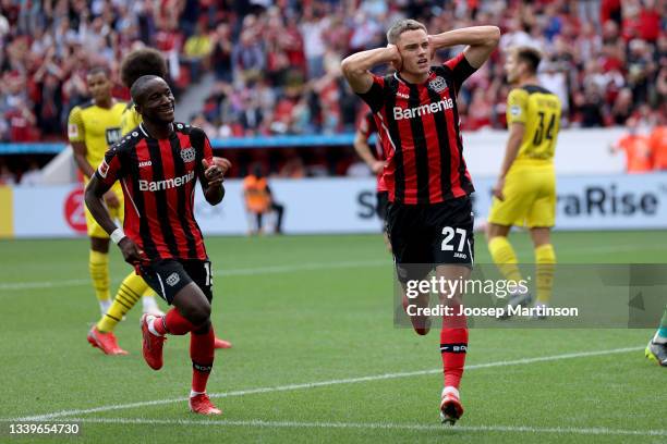 Moussa Diaby and Florian Wirtz of Leverkusen celebrate their teams first goal during the Bundesliga match between Bayer 04 Leverkusen and Borussia...