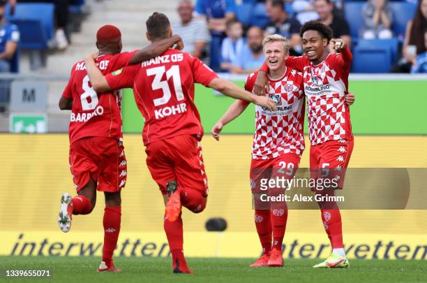 Jonathan Burkardt of 1. FSV Mainz 05 celebrates scoring the opening goal with Leandro Barreiro Martins, Dominik Kohr and Jean-Paul Boëtius during the...