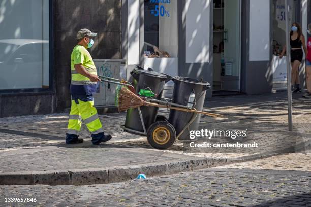 street sweeper at work - street sweeper stockfoto's en -beelden