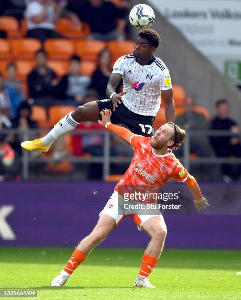 Fulham player Ivan Cavaleiro challenges Blackpool player Josh Bowler during the Sky Bet Championship match between Blackpool and Fulham at Bloomfield...
