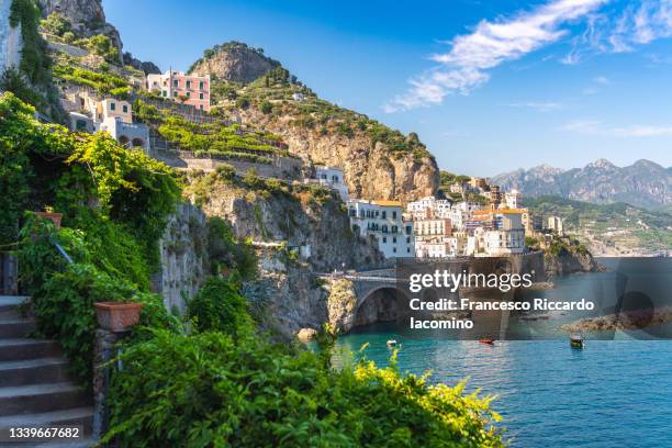 atrani, amalfi coast, campania, sorrento, italy. view of the town and the seaside in a summer sunset - mediterranean sea foto e immagini stock