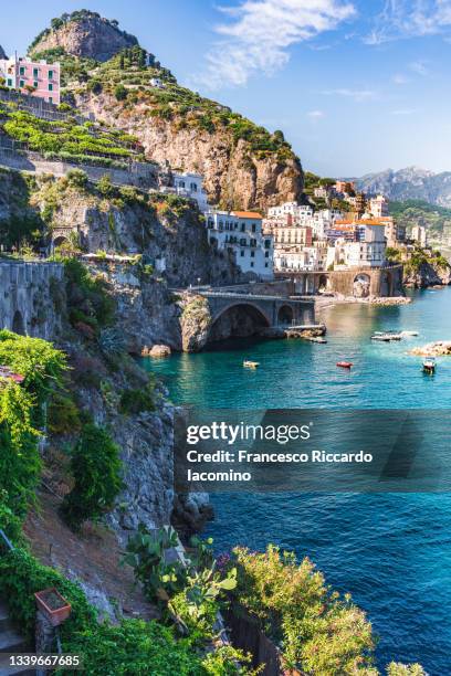 atrani, amalfi coast, campania, sorrento, italy. view of the town and the seaside in a summer sunset - sorrento stockfoto's en -beelden