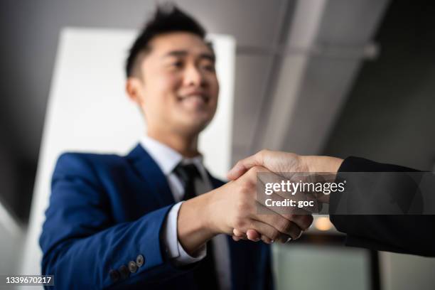 successful business deal with handshake - bank manager stock pictures, royalty-free photos & images