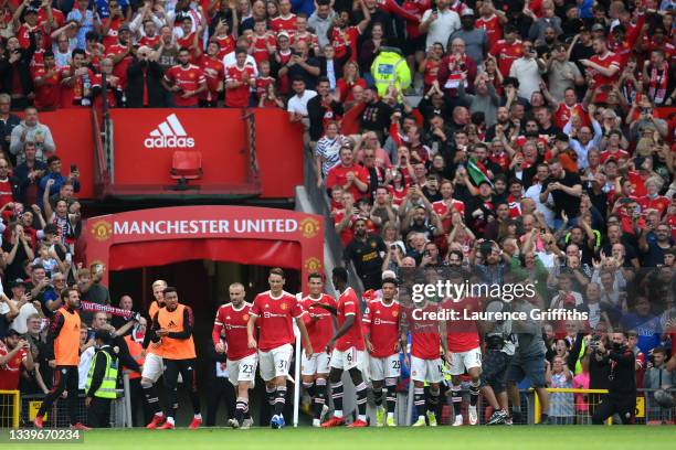 Cristiano Ronaldo of Manchester United celebrates with team mates after scoring their side's second goal during the Premier League match between...