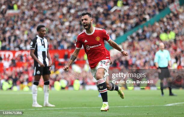 Bruno Fernandes of Manchester United celebrates after scoring their side's third goal during the Premier League match between Manchester United and...