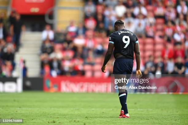 Michail Antonio of West Ham United looks dejected after being shown a red card during the Premier League match between Southampton and West Ham...