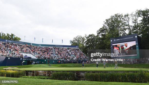 Adam Scott of Australia acknowledges the crowd on the 18th green during Day Three of The BMW PGA Championship at Wentworth Golf Club on September 11,...