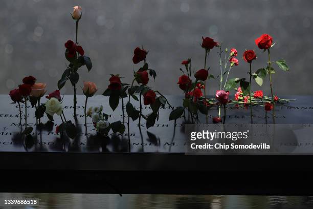 Flowers are placed into the inscribed names of the victims of the 9/11 attacks and in the 1993 World Trade Center bombing during the annual...