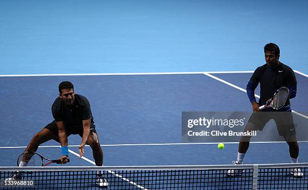 Mahesh Bhupathi of India and Leander Paes of India play during the men's doubles match against Jurgen Melzer of Austria and Philipp Petzschner of...