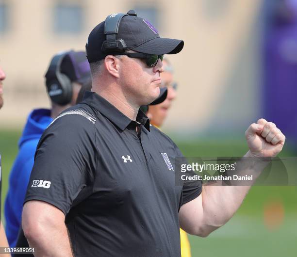 Head coach Pat Fitzgerald of the Northwestern Wildcats encourages his team against the Indiana State Sycamores at Ryan Field on September 11, 2021 in...