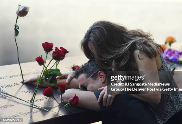 Shelli Scrimale kisses her husband David Pykon on the head at the National 9/11 Memorial and Museum after the ceremony marking the 20th anniversary...