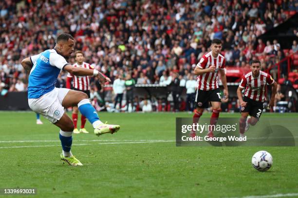 Jonson Clarke-Harris of Peterborough United scores their side's second goal from the penalty spot during the Sky Bet Championship match between...