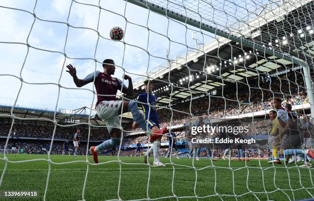 Ezri Konsa of Aston Villa makes a goal-line clearance during the Premier League match between Chelsea and Aston Villa at Stamford Bridge on September...