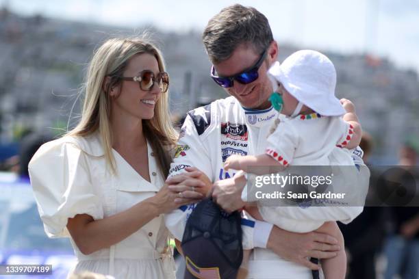 Dale Earnhardt Jr., driver of the Unilever United For America Chevrolet, spends time with his wife, Amy and daughter, Nicole Lorraine on the grid...