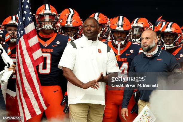 Head Coach Dino Babers of the Syracuse Orange takes a moment prior to a game against the Rutgers Scarlet Knights at Carrier Dome on September 11,...