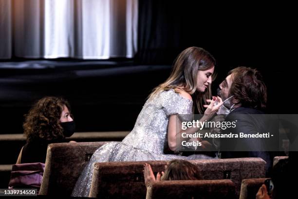 Penelope Cruz kisses her husband Javier Bardem prior receiving the Coppa Volpi for best actress for the movie "Madres Paralelas" during the closing...