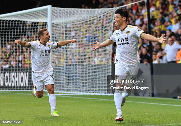 Hee-Chan Hwang of Wolverhampton Wanderers celebrates with team mate Daniel Podence after scoring his sides second goal during the Premier League...