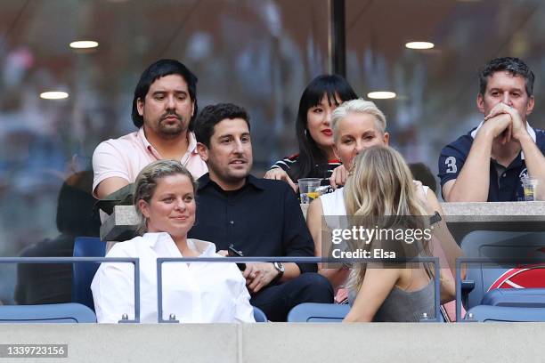 Tennis pro Kim Clijsters of Belgium, actor Jason Biggs and actress Jenny Mollen watch play during the Women's Singles final match between Emma...