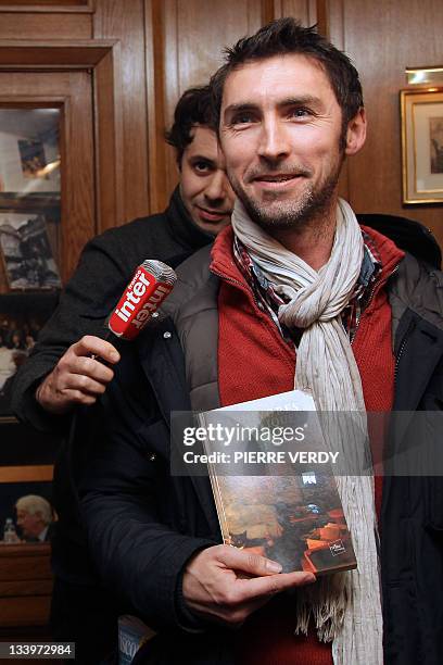 French novelist Erwann Créac'h shows his novel "Carnivores Domestiques" after being awarded with the 30 Millions d’amis literary prize on November...