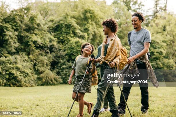 spending time in nature - african american hiking stock pictures, royalty-free photos & images