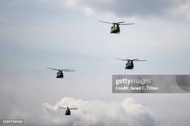 Chinook Helicopters perform a flyby prior to the NASCAR Xfinity Series Go Bowling 250 at Richmond Raceway on September 11, 2021 in Richmond, Virginia.