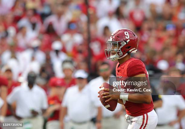 Bryce Young of the Alabama Crimson Tide looks to pass against the Mercer Bears during the first half at Bryant-Denny Stadium on September 11, 2021 in...