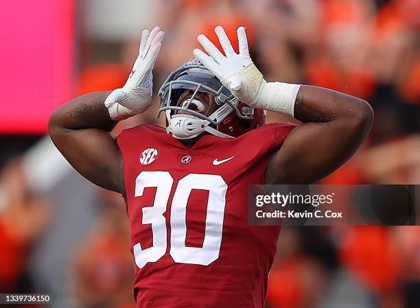 King Mwikuta of the Alabama Crimson Tide reacts after a defensive stop against the Mercer Bears during the second half at Bryant-Denny Stadium on...