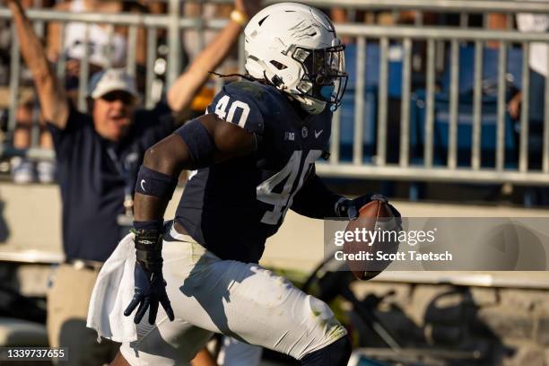 Jesse Luketa of the Penn State Nittany Lions intercepts a pass for a touchdown against the Ball State Cardinals during the second half at Beaver...