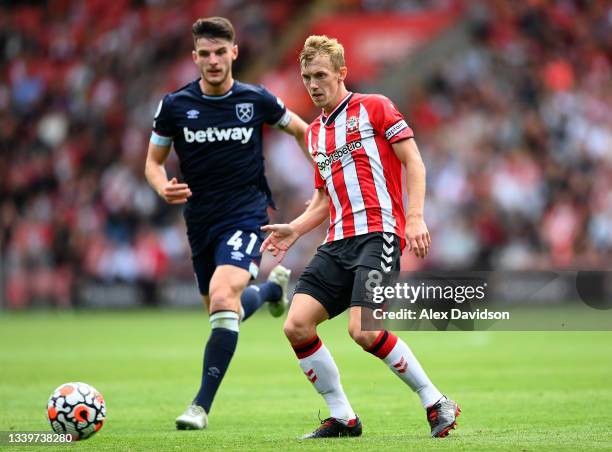 James Ward-Prowse of Southampton passes under pressure from Declan Rice of West Ham United during the Premier League match between Southampton and...