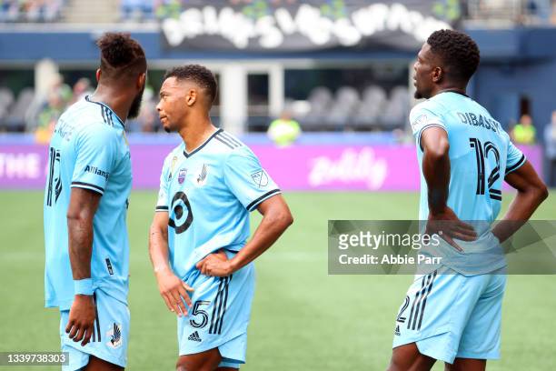 Romain Metanire, Jacori Hayes and Bakaye Dibassy of Minnesota United react after their 1-0 loss to the Seattle Sounders at Lumen Field on September...