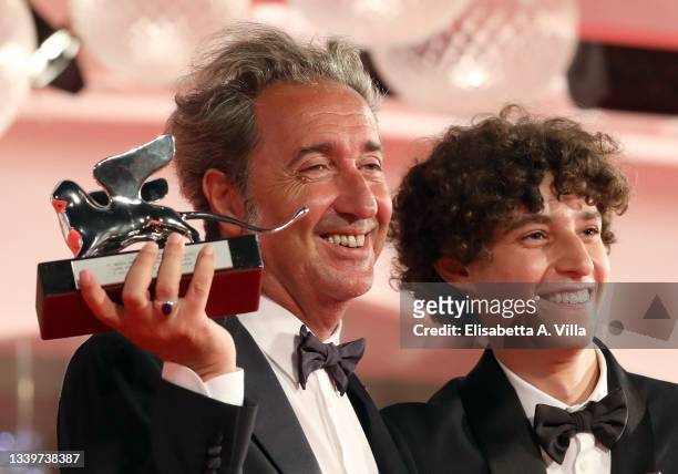 Director Paolo Sorrentino poses with the Silver Lion Grand Jury Prize and Filippo Scotti poses with the Marcello Mastroianni Award for Best New Young...