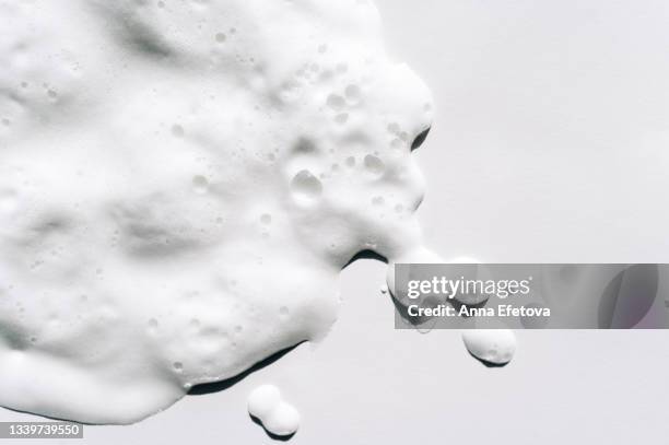 texture of white foam on white background. facial cleanser for perfect skin. copy space for your design. macrophotography in flat lay style - 石鹸 ストックフォトと画像