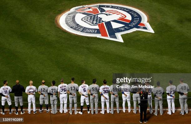 The New York Mets and New York Yankees stand side by side during ceremonies honoring the 20th anniversary of the 9/11 terrorist attacks prior to a...