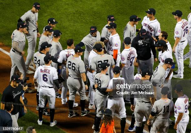 The New York Mets and New York Yankees interact during ceremonies honoring the 20th anniversary of the 9/11 terrorist attacks prior to a game between...