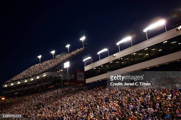 General view of NASCAR fans waving American flags during the start of NASCAR Cup Series Federated Auto Parts 400 Salute to First Responders at...