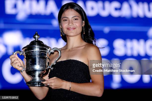 Emma Raducanu of Great Britain poses with the championship trophy after defeating Leylah Annie Fernandez of Canada during their Women's Singles final...