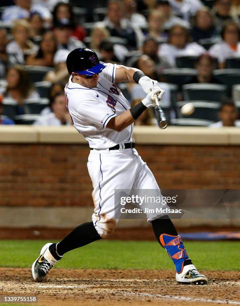 James McCann of the New York Mets connects on his sixth inning two-run home run against the New York Yankees at Citi Field on September 11, 2021 in...